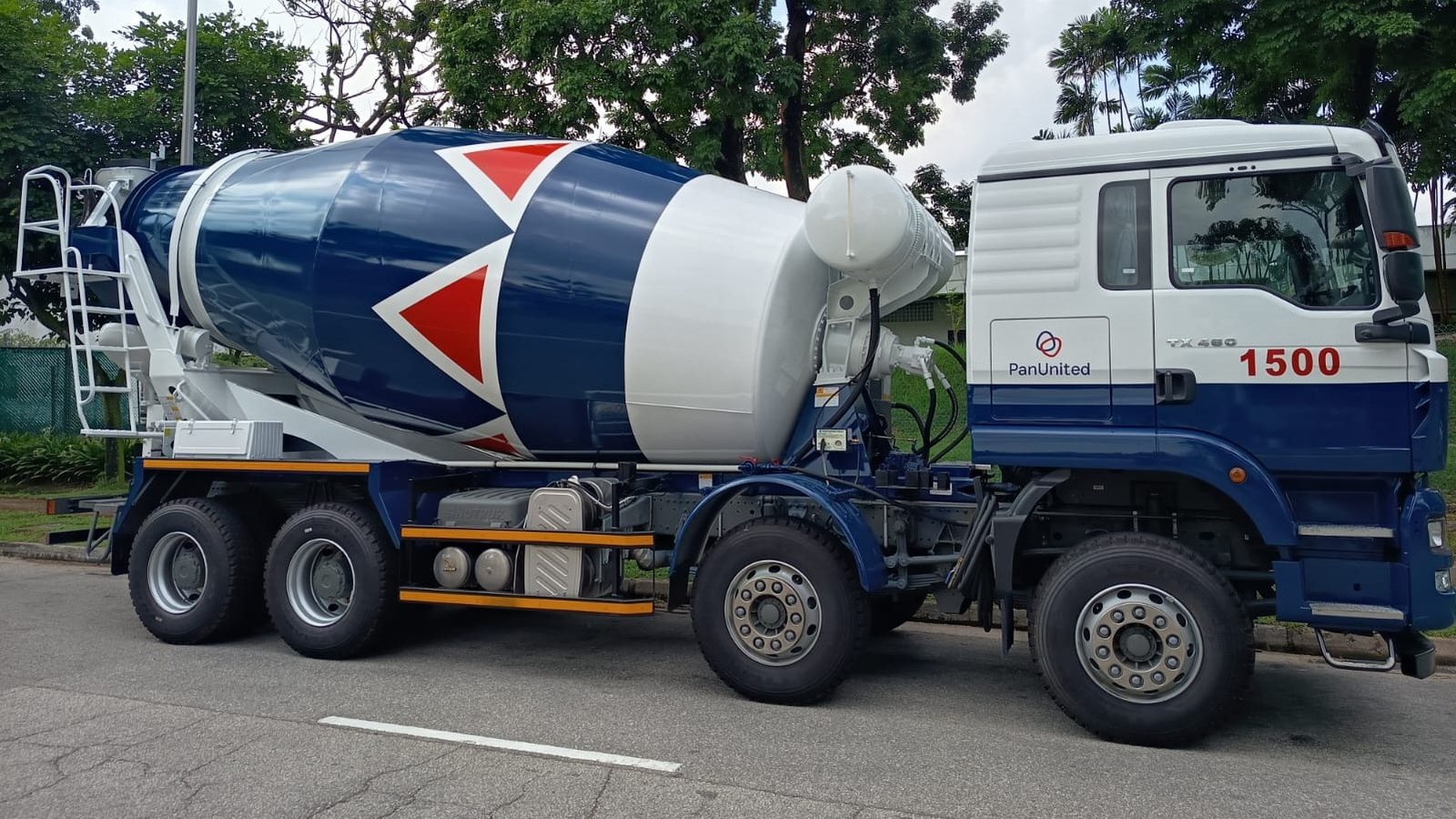 PanUnited cement mixer truck, side view, parked on a Singapore road